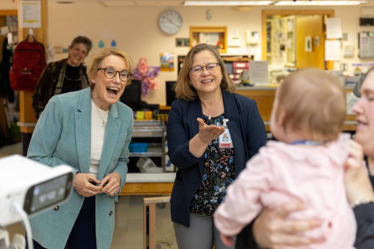 Senator Maggie Hassan and director of Nursing, Buffy Meliment interact with Cedarcrest child.